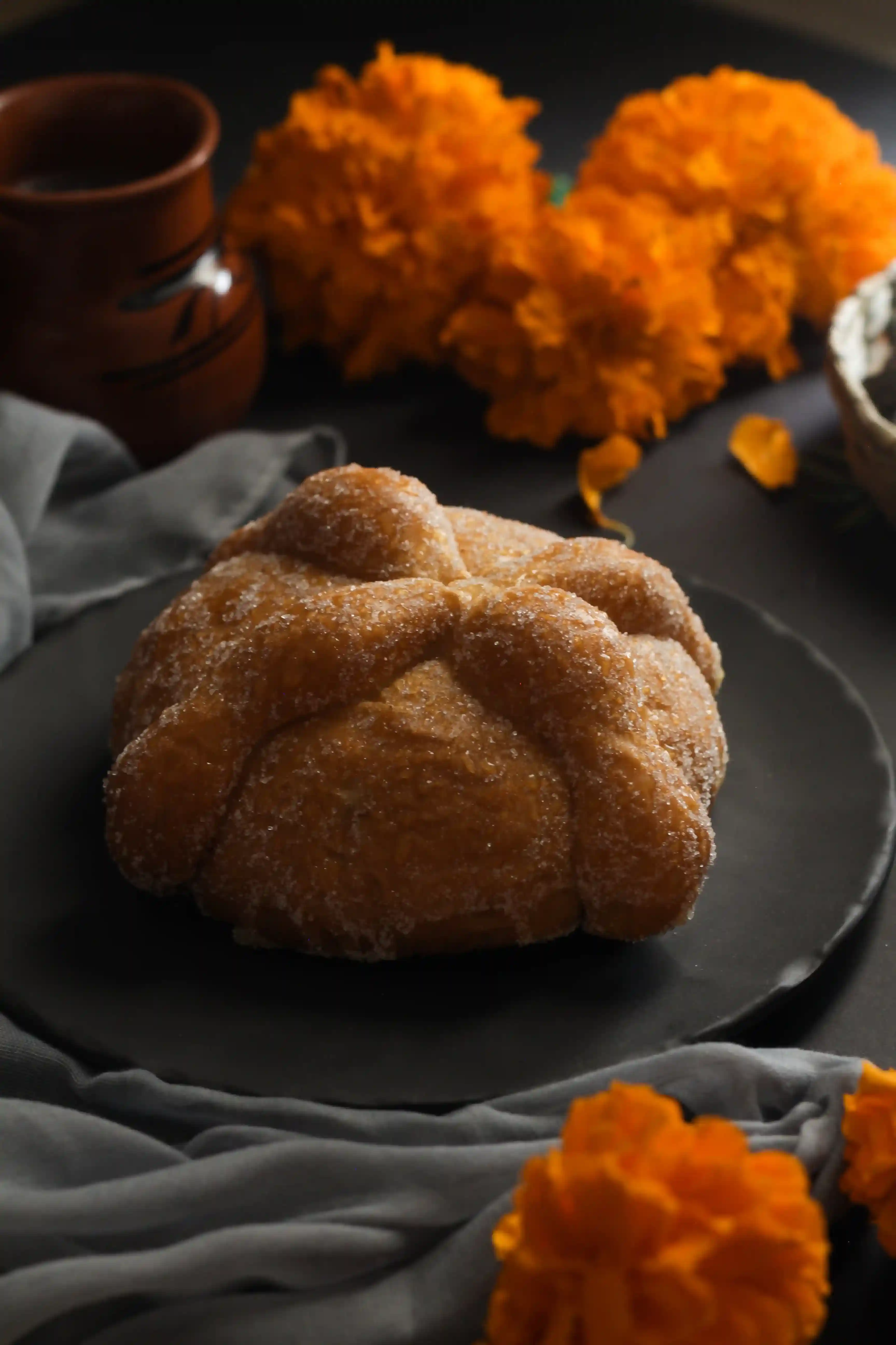 image of pan de muerto on a plate